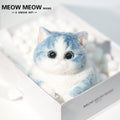 C35:A Blue Kitten Holding A Baby Bottle