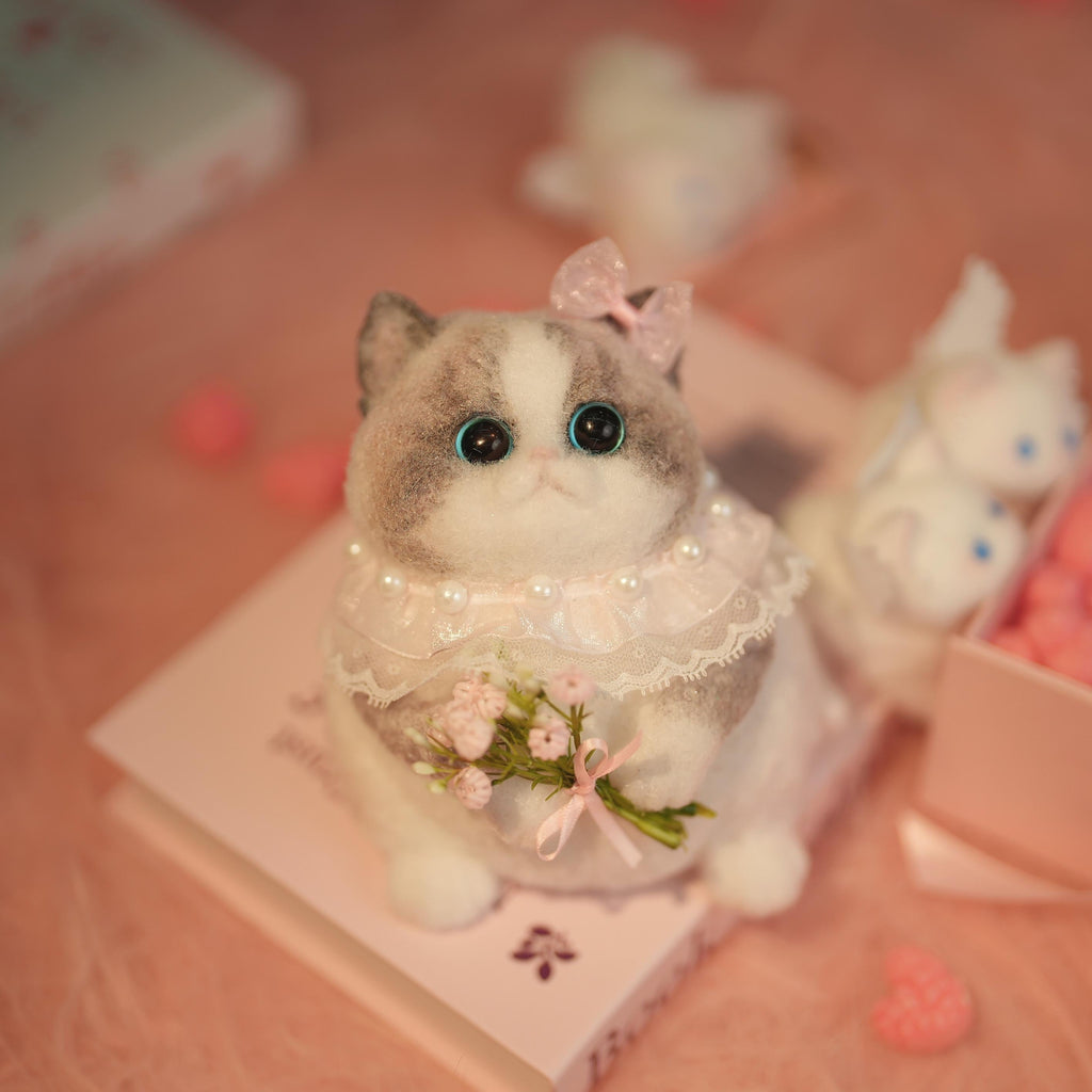 C22:A Chubby Ragdoll Cat Holding Flowers