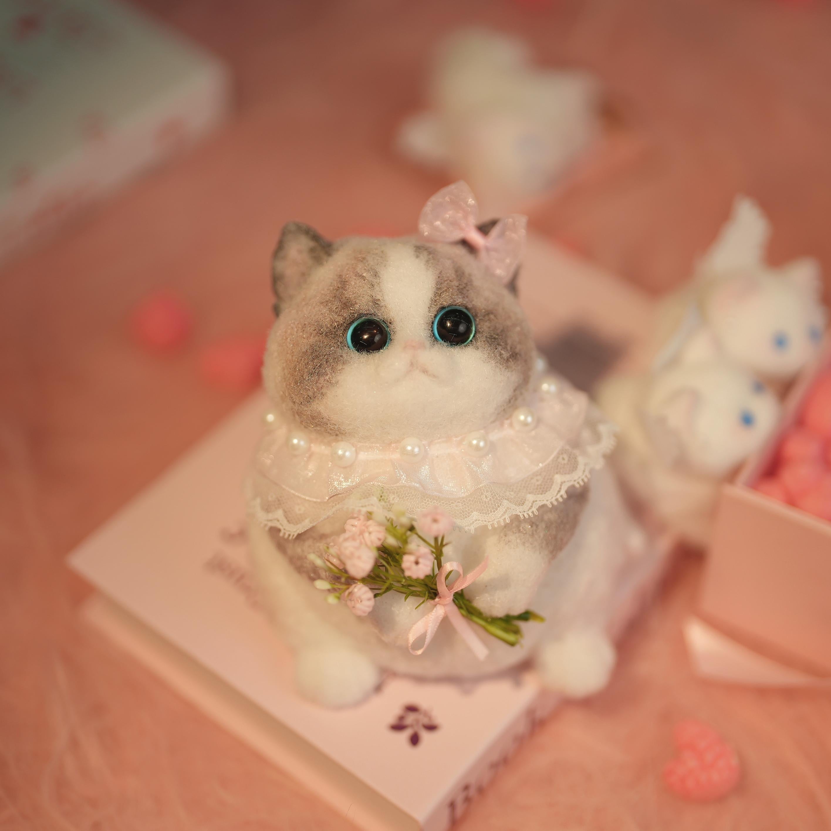 C22:A Chubby Ragdoll Cat Holding Flowers